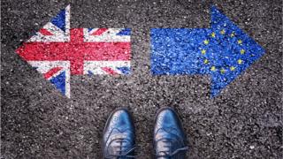 A union flag pointing left and the EU flag pointing right