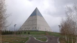 A pyramid-shaped building designed by Norman Foster stands in the Kazakh capital Astana