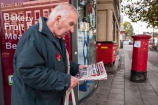 A man reads the Daily Mail