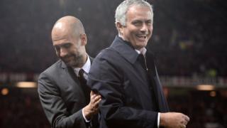 Pep Guardiola and Jose Mourinho share a joke on the touchline.