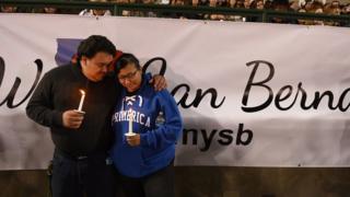 Mourners at a vigil in San Bernardino