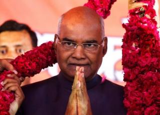 Supporters of Ram Nath Kovind, nominated presidential candidate of India’s ruling Bharatiya Janata Party (BJP), present him with a garland during a welcoming ceremony as part of his nation-wide tour, in Ahmedabad, India, July 15, 2017