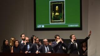 Christie's employees take bids for Salvator Mundi in New York November 15, 2017