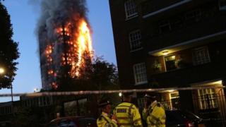 Police man the cordon during Grenfell Tower block fire