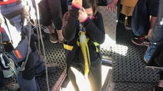 Jennifer Jones starts her descent from the cable car