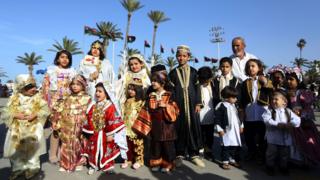 Libyans dressed in their country"s traditional clothing attend the national day of the Libyan costume at the Martyrs Square in the capital Tripoli, on March 13, 2018