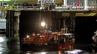 Douglas lifeboat Sir William Hillary berthing the casualty vessel at the Battery Pier