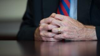 Hands clasped