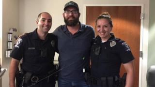 John Ogburn with the police officers who saved him, Lawrence Guiler (L) and Nikolina Bajic