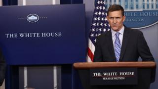 White House Press Secretary Sean Spicer (L) yields the briefing room podium to National Security Adviser Michael Flynn February 1, 2017 in Washington, DC.