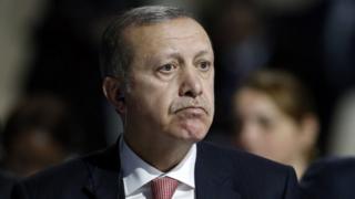 Turkey's President Recep Tayyip Erdogan listens to statements at the COP21, United Nations Climate Change Conference, in Le Bourget, outside Paris, on Monday