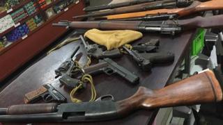 A pile of guns handed in to authorities
