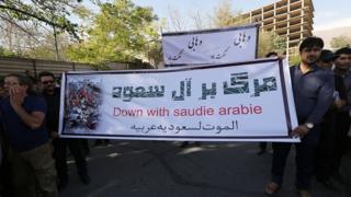 Iranian protesters hold a banner during a demonstration against Saudi Arabia outside the Saudi embassy in Tehran on 27 September 2015