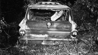 Burned out wreckage of the men, in black and white image released by the FBI