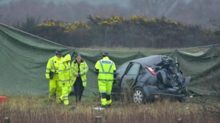 Police with crashed car