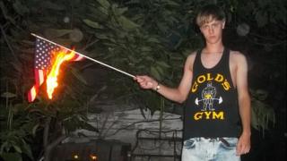 An image appearing to show Charleston church shooting suspect Dylann Roof burning a US flag - 11 May 2015