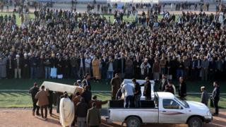 Mourners carry the coffins of people killed in a truck bombing in the north-western coastal city of Zliten