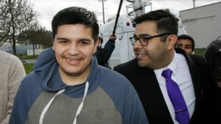 Daniel Ramirez Medina walks with with his attorney, Luis Cortes, right, after Ramirez was freed from custody at the Northwest Detention Center in Tacoma