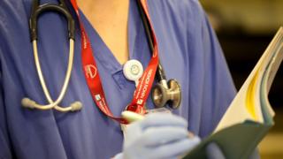 An NHS nurse in an operating theatre at Birmingham Women's Hospital, 22 January 2015