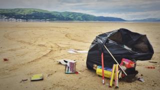 Discarded fireworks at Dyfi Ynyslas nature reserve beach