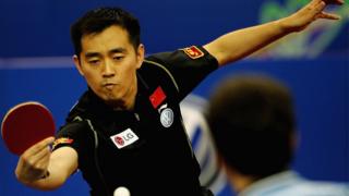 Kong Linghui of China returns a shot during the men's doubles final of the 48th World Table Tennis Championships against Timo Boll and Christian Suss of Germany at Shanghai Gymnasium on May 5, 2005 in Shanghai, China