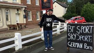 'German porn' sign on the roadside with Monkmoor Pub employee