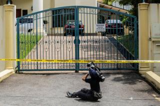 A cameraman films the gates of the North Korean embassy, surrounded by a police cordon, in Kuala Lumpur, Malaysia, 7 March 2017.
