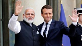 Indian Prime Minister Narendra Modi (L) is greeted by French President Emmanuel Macron (R) on the last leg of his four-nation visit at the Elysee palace in Paris, France, June 3, 2017