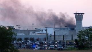 Smoke rises from Cadereyta prison where a brawl left several prisoners wounded on March 27, 2017 in Cadereyta, Nuevo Leon, Mexico.