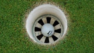 Golf ball in hole