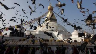 Pigeons flying in front of Boudhanath Stupa during the opening ceremony of the stupa in Kathmandu (22 November 2016)
