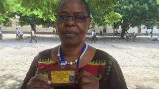 Beatrice Mhina, headmistress at Turiana Secondary School with her ID card for free bus travel.