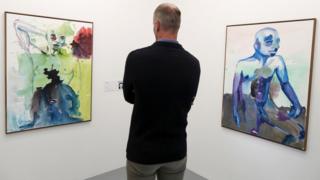 A man looks at artworks by Banele Khoza from Swaziland on exhibit at the Zeitz Museum of Contemporary Art Africa (Zeitz MOCAA) at the V^A Waterfront in Cape Town, South Africa, 09 May 2018. This new exhibition in the Curatorial Lab of the Zeitz MOCAA in partnership with the Consulate General of the Netherlands investigates the lack of representation and current oppression of the LGBT community in Africa.