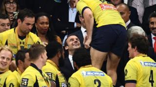 French President Emmanuel Macron congratulates Clermont's rugby players on June 4, 2017 at the Stade de France in Saint-Denis, outside Paris