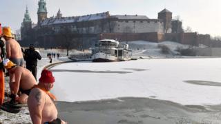 Cold weather enthusiasts, called Walruses, swim in the Wistula river in Krakow