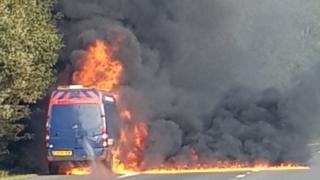 The van on fire on the M4