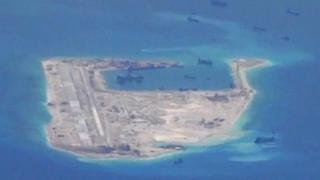 Chinese vessels at work in an aerial view of the Fiery Cross Reef in the South China Sea