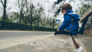 Child sitting on bench