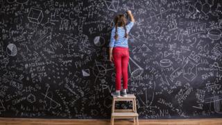 Girl at blackboard