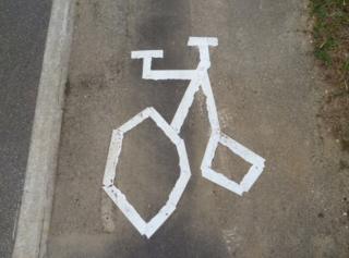Crooked marking of a bike on a cycle path