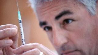 Doctor with syringe