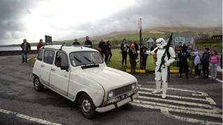 A Stormtooper stops a car