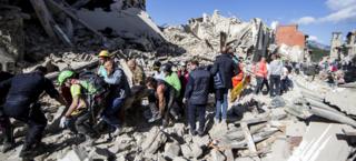 Rescuers in Amatrice, Italy on 24 August 2016