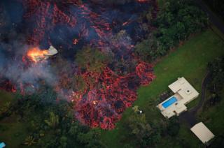 Lava approaches a home near Pahoa, Hawaii