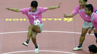 Chinlone players in tournament