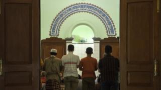 Indonesian men pray at a fundamentalist mosque on February 3, 2016 in Solo, Indonesia.