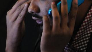 Pakistani man with phone