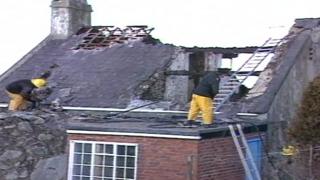 Firemen tackling a blaze at a holiday home