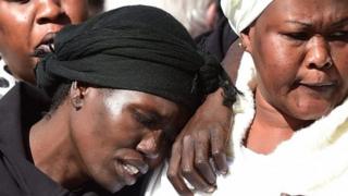 Akon Guode, (L), who has been sentenced over the murder of two of her children and the infanticide of another in Melbourne, Australia, after driving her car into a lake in 2015