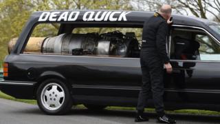 Matt McKeown with his converted 1992 Ford Cardinal hearse "Dead Quick" at the Prescott Hill Climb in Gloucestershire.